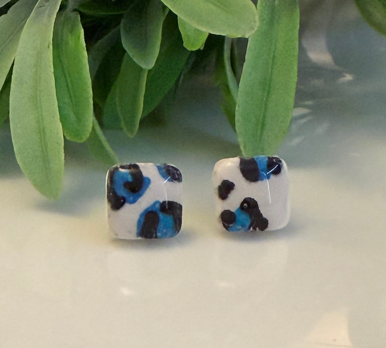 Blue animal print square studs