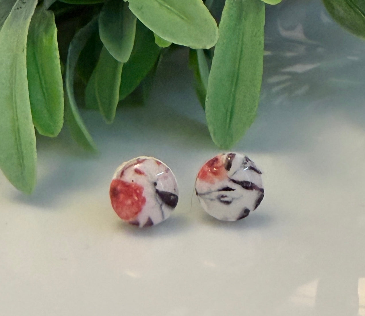 Orange floral print round studs